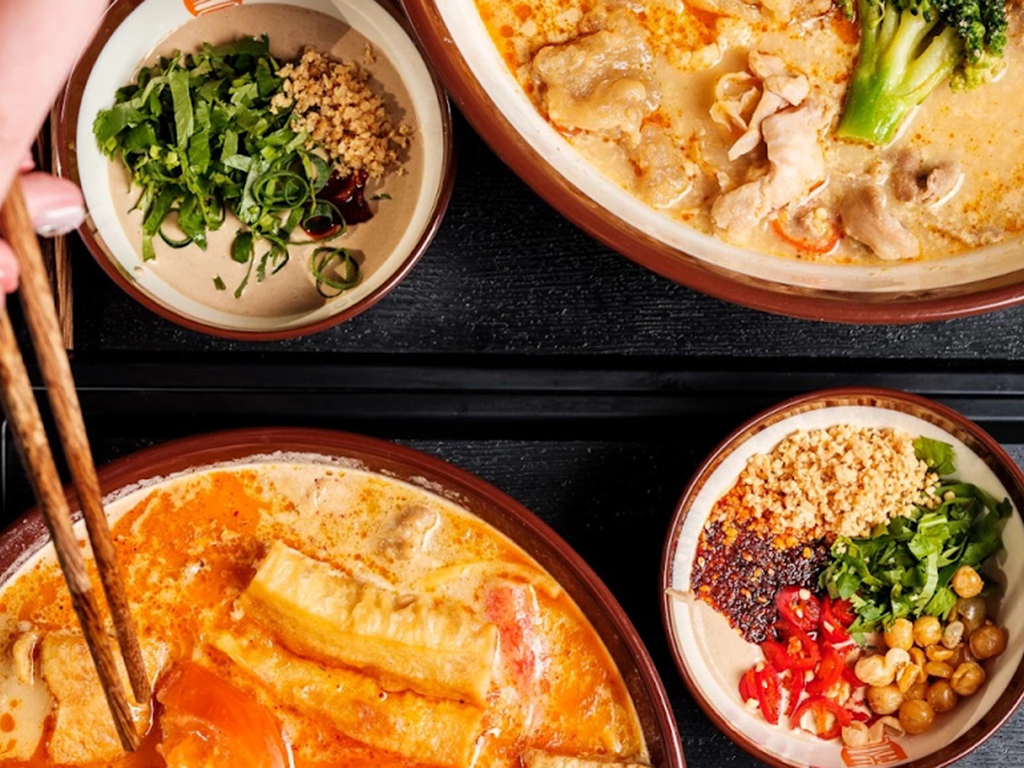 Creamy spicy mala bowl with crispy toppings and homemade dipping sauces at Zhangliang Malatang, a Chinese Restaurant in Mountain View