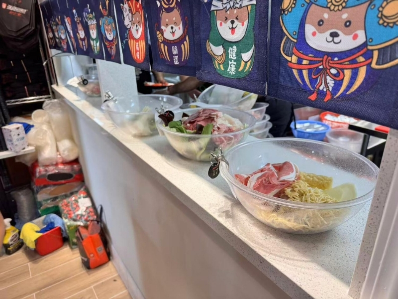Ingredient bowls at food bar at Zhangliang Malatang Spicy Hotpot, a Hot Pot Restaurant in National City