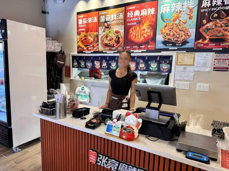 Store counter with menu & staff at Zhangliang Malatang Spicy Hotpot, a Hot Pot Restaurant in National City