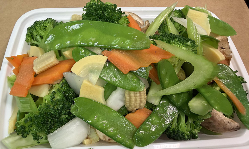 Mixed Chinese stir-fried vegetables with snow peas, broccoli, and carrots.