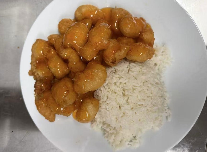 Orange chicken with rice at Zheng Hua Restaurant, a Asian restaurant in Portland