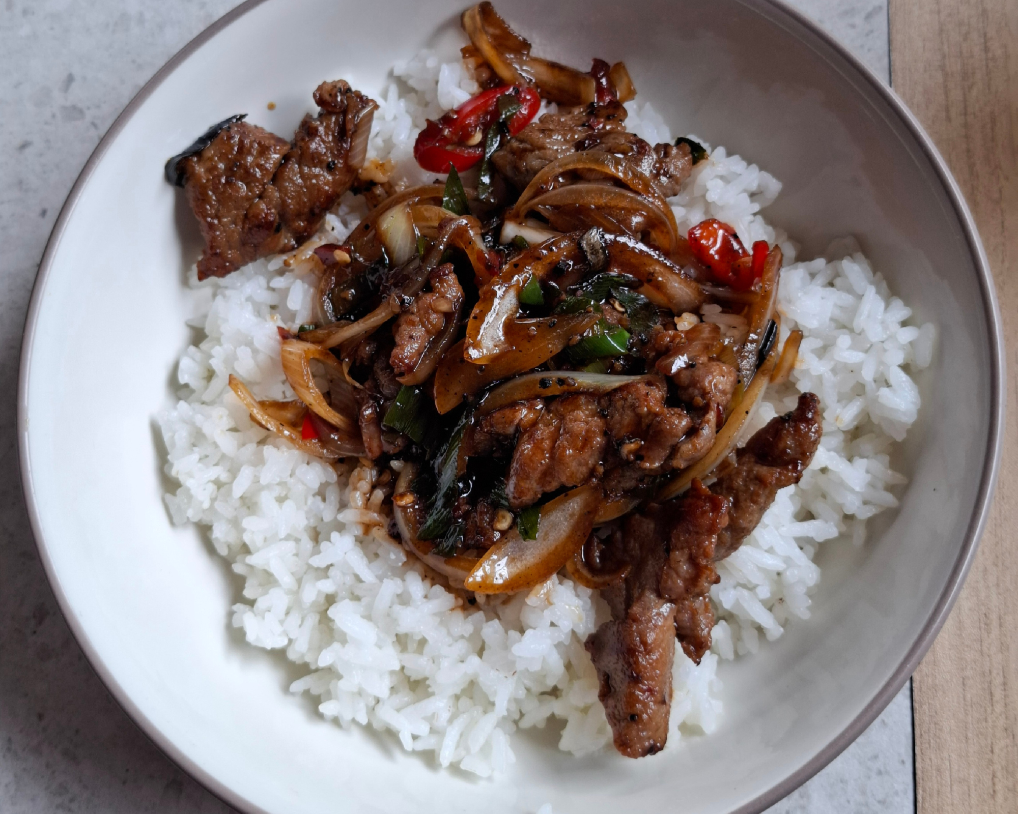 Beef with onions over rice from Zhenwei Kitchen Asian restaurant in Alhambra.