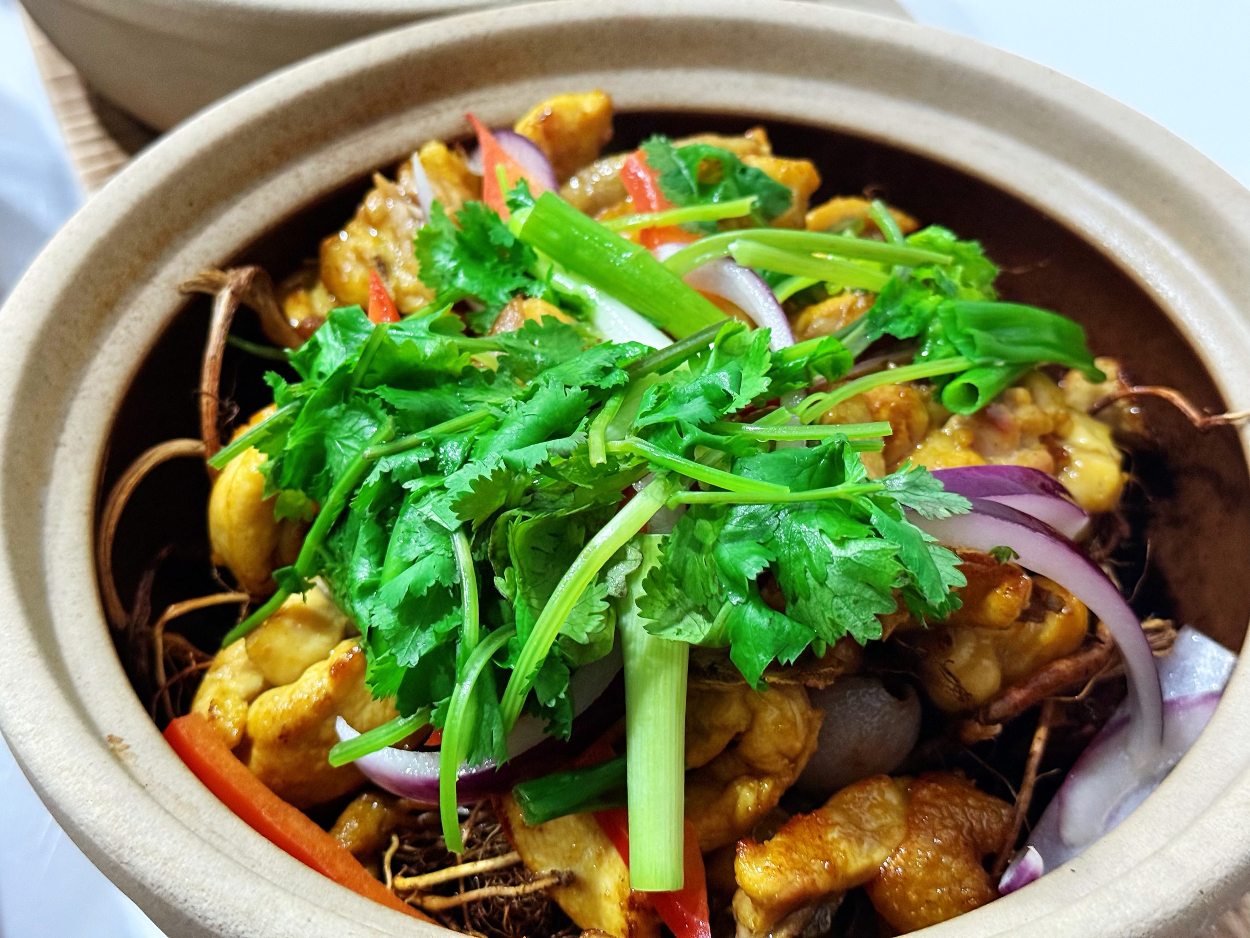 Five-finger hair peach zhe zhe chicken pot with cilantro at Zhe Zhe Pot, a Chinese Restaurant in Brooklyn