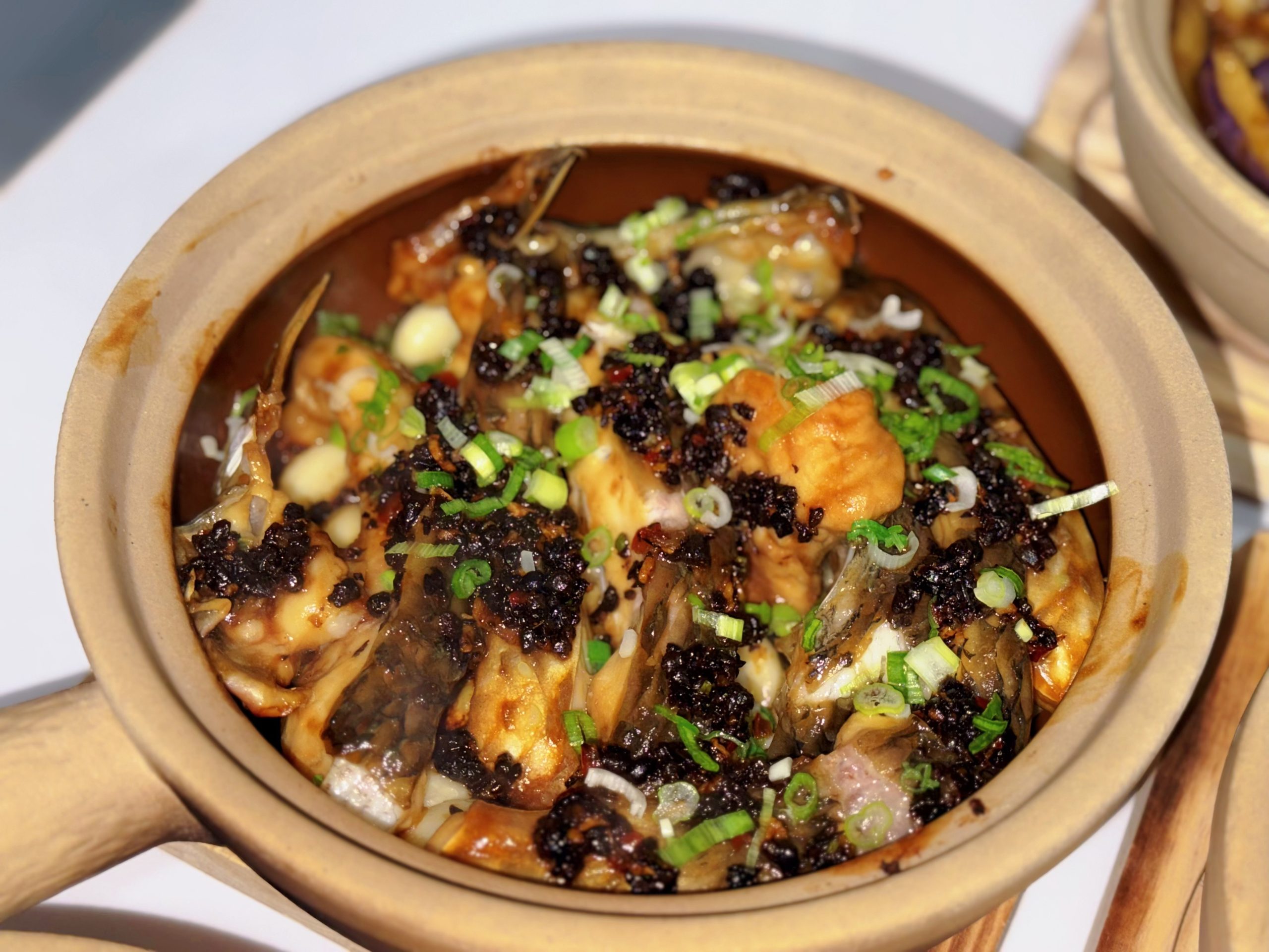 Black bean frog pot with green onion at Zhe Zhe Pot, a Chinese Restaurant in Brooklyn
