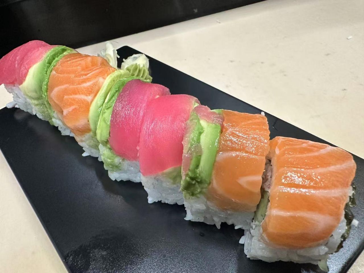 Rainbow Roll with tuna, salmon and avocado at ZX Sushi, a Japanese Restaurant in Milwaukee