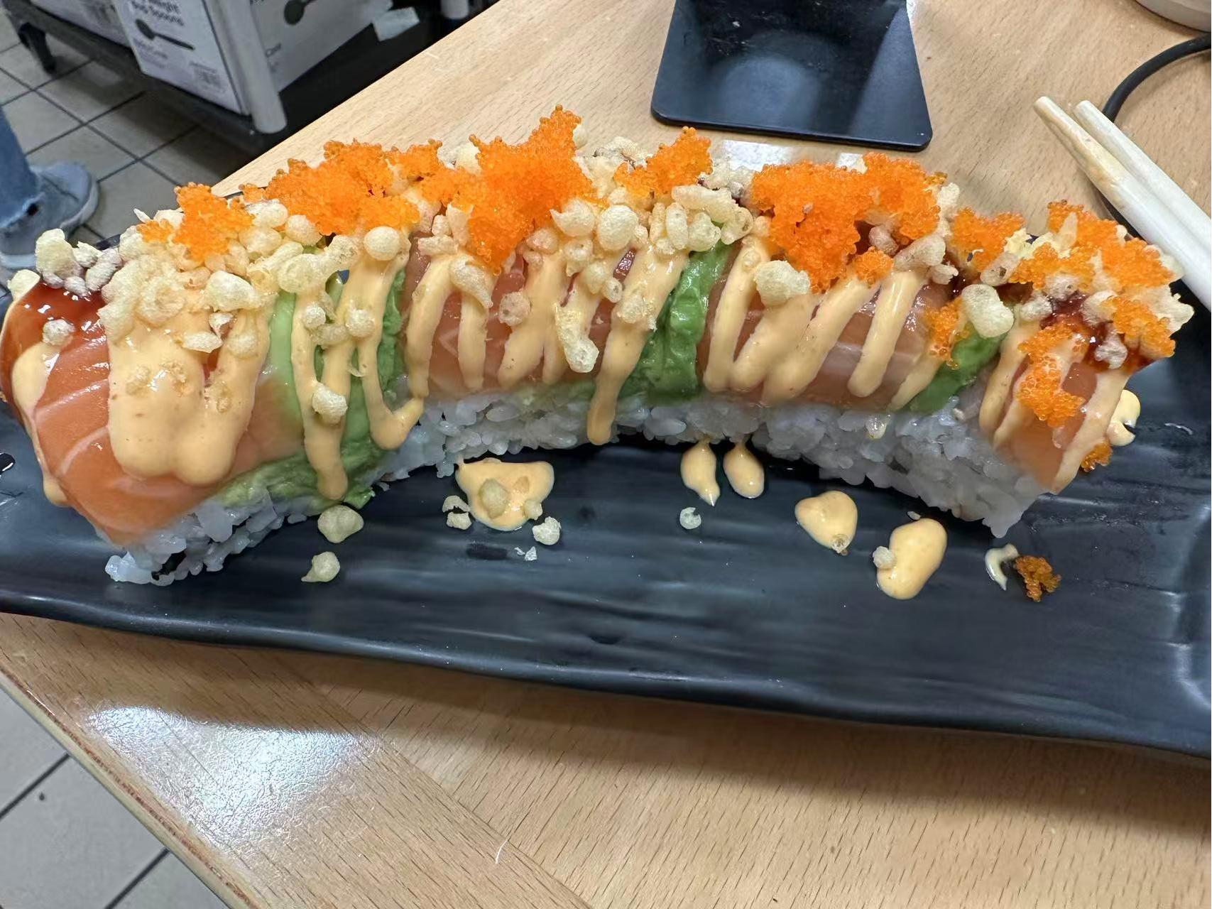 Crouching Tiger Roll with fish roe and sauce at ZX Sushi, a Japanese Restaurant in Milwaukee