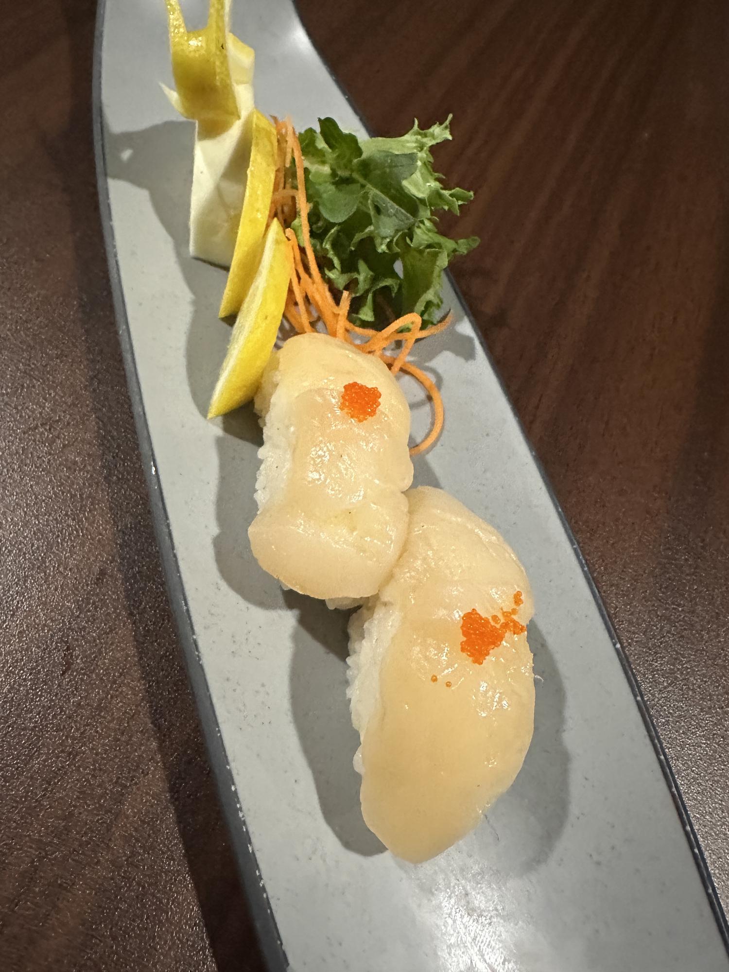 Scallop Nigiri with Tobiko and Lemon Garnish at ZX Sushi, Japanese Restaurant in Milwaukee